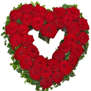 Rouwarrangement open hart vorm rode rozen